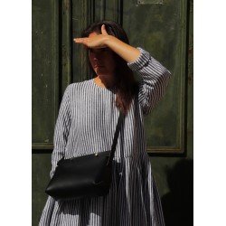 The shoulder strap triangle bag, black leather