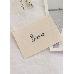 Embroided words "Bisous"